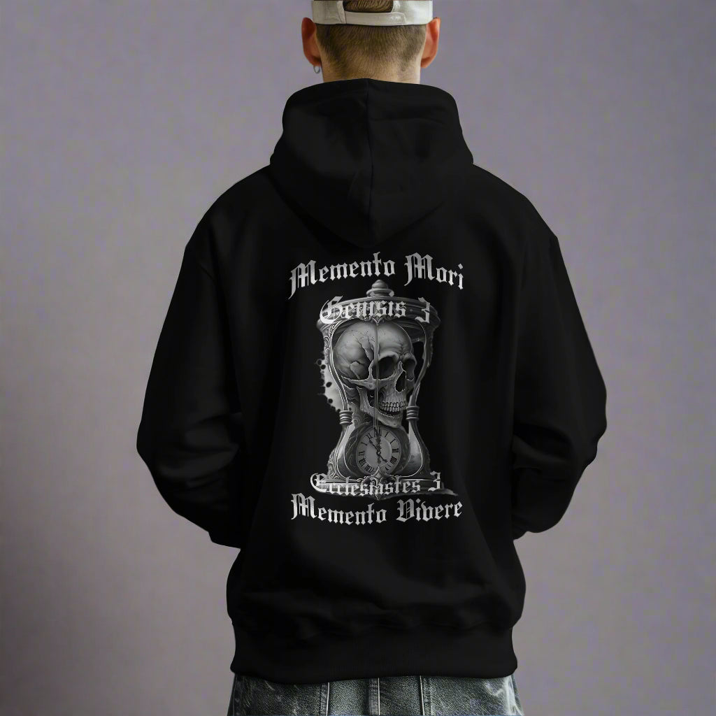 Person wearing a black hoodie with a skull design and text on the back, standing in an indoor setting.