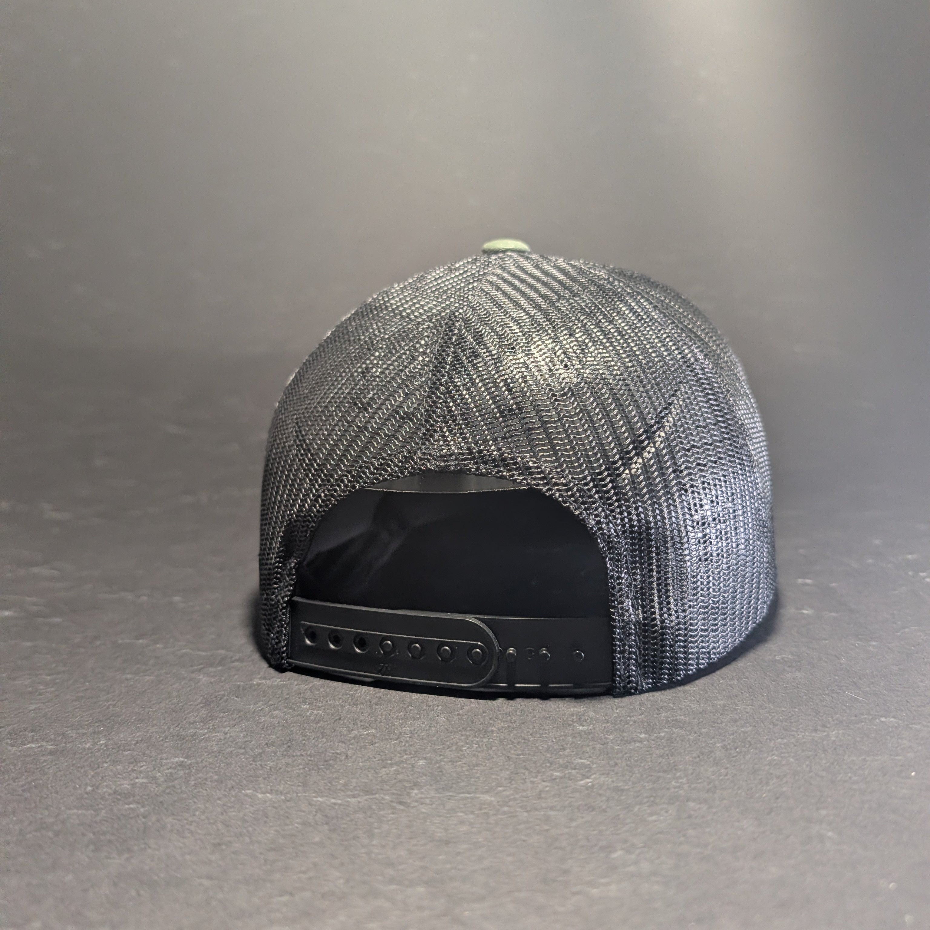 Jerusalem Cross Blackout all black flat bill snapback, rear view showing black mesh back and snapback closure