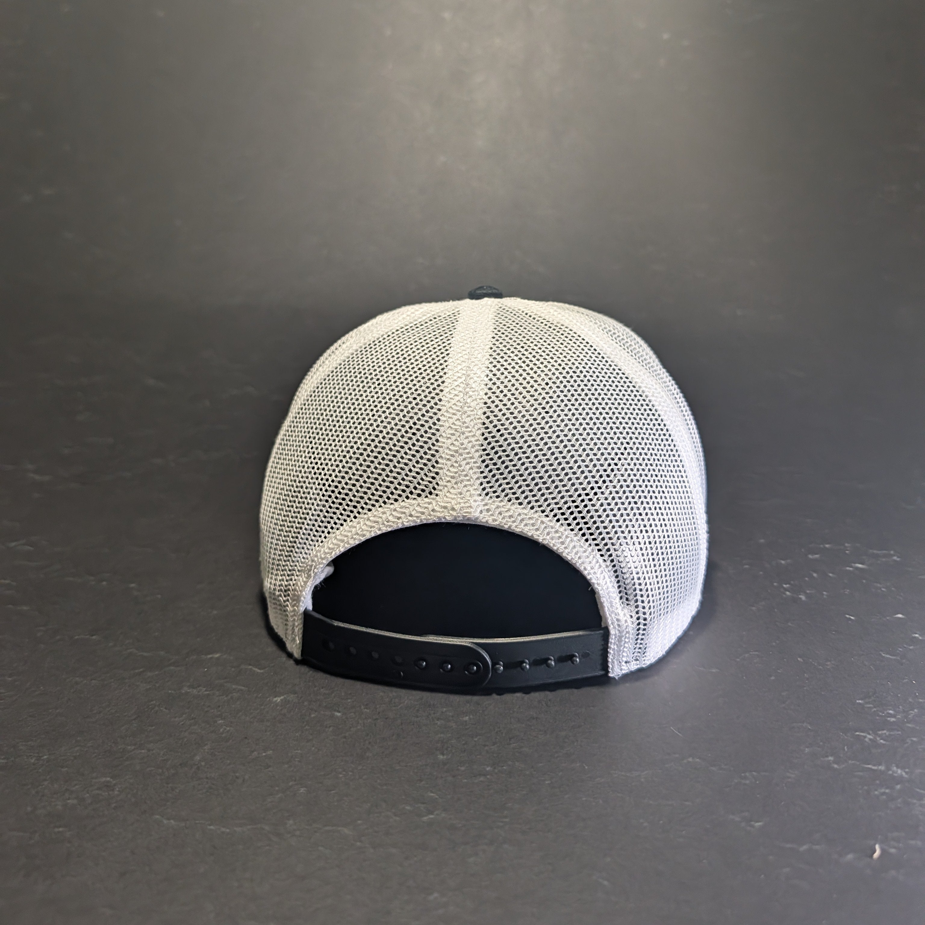 Jerusalem Cross White black and white flat bill snapback, rear view showing white mesh and snapback closure