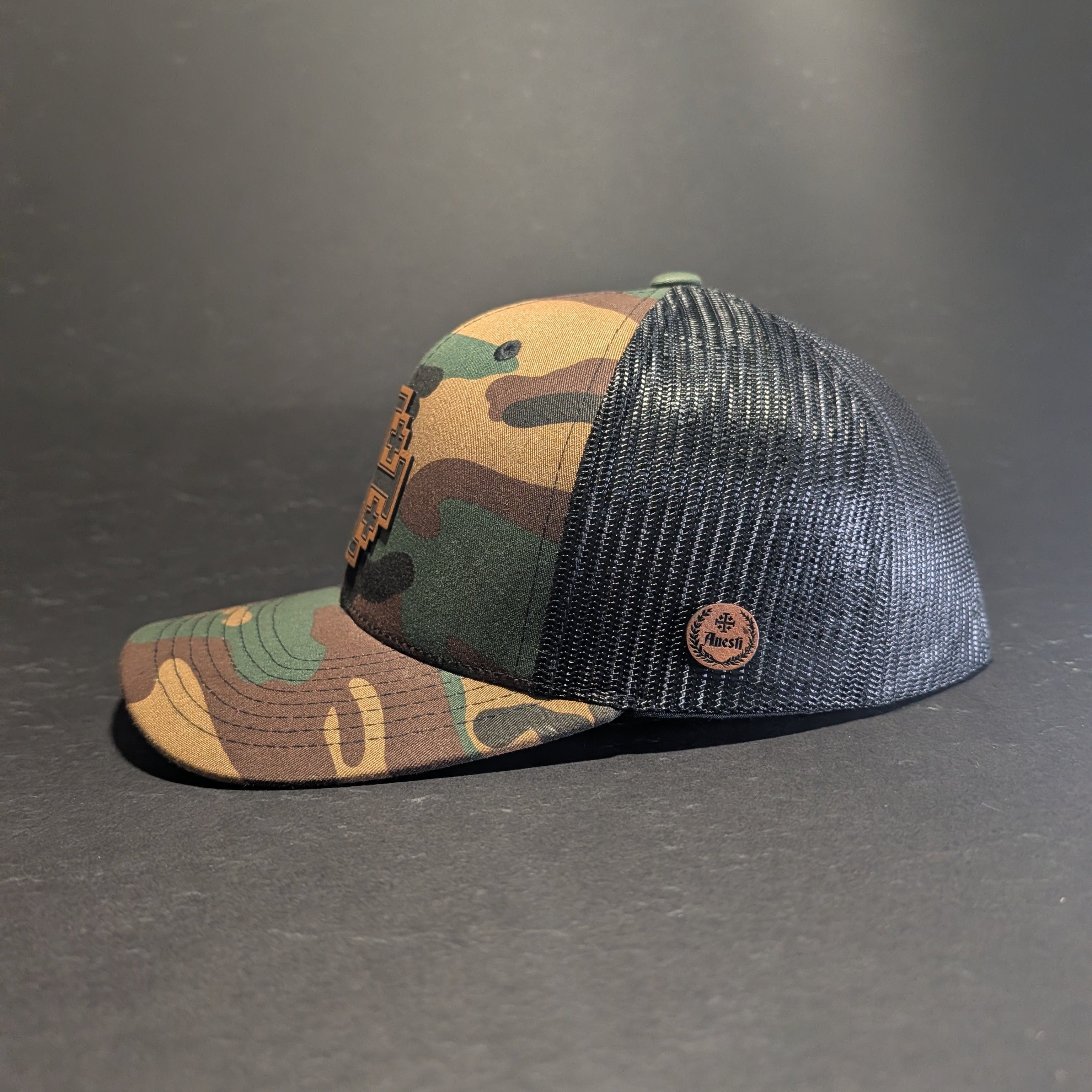 Jerusalem Cross Woodland curve bill snapback, side profile with olive mesh and tan Anesti leatherette crest